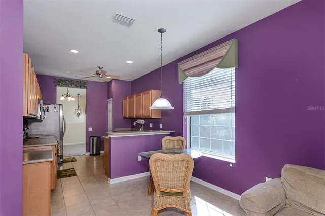 a bedroom with a large bed and a large window