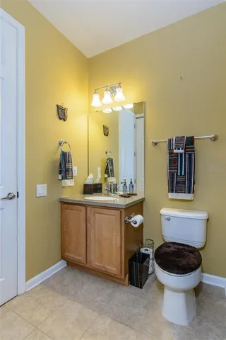 a view of a swimming pool with a yard and large trees