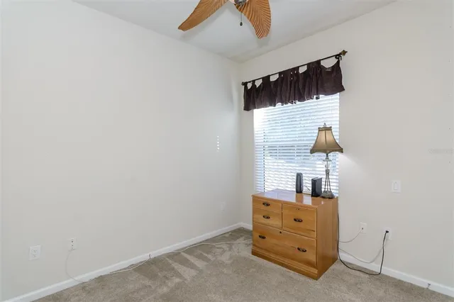 a view of a swimming pool with lounge chairs