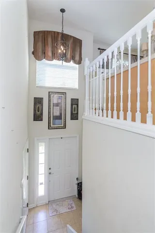 a bedroom with furniture and window