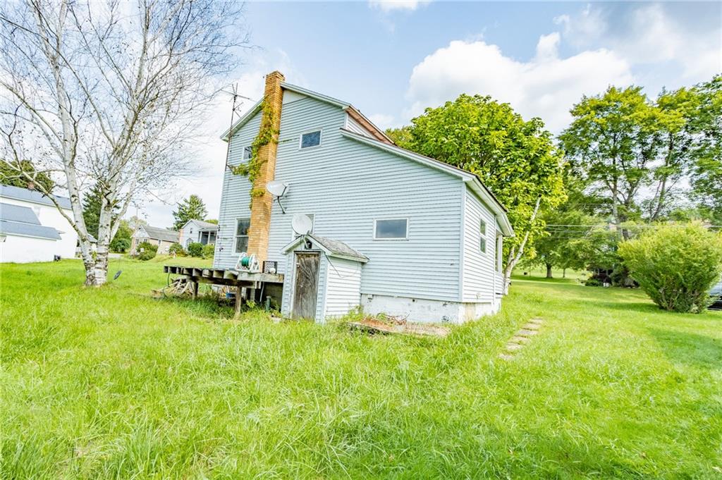 2318 McIntyre Road McIntyre, PA 15756 - Photo 5 of 5 a backyard of a house with table and chairs