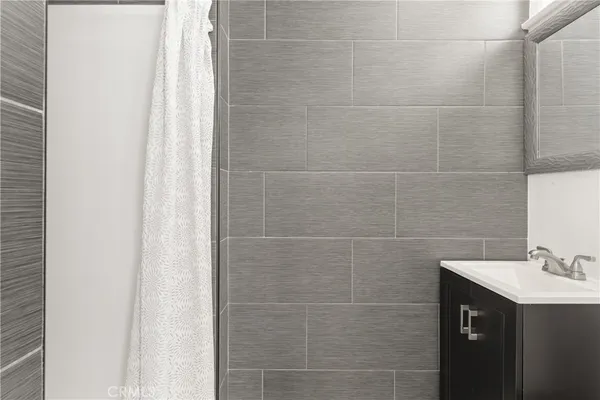 a bathroom with a sink and mirror