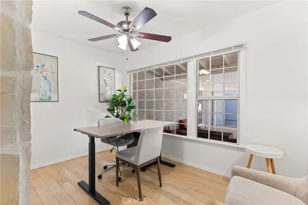a view of a livingroom with furniture and a potted plant