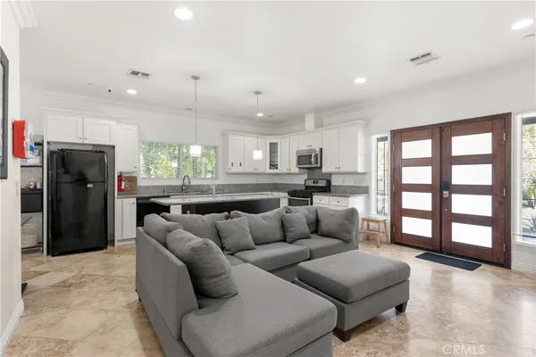 a living room with furniture and a large window