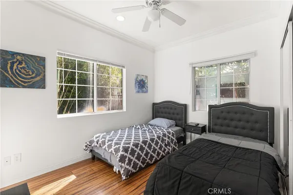 a bedroom with bed and a window