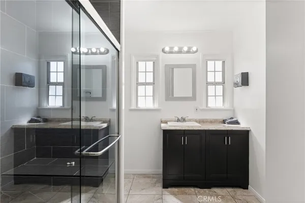 a bathroom with a sink and mirror