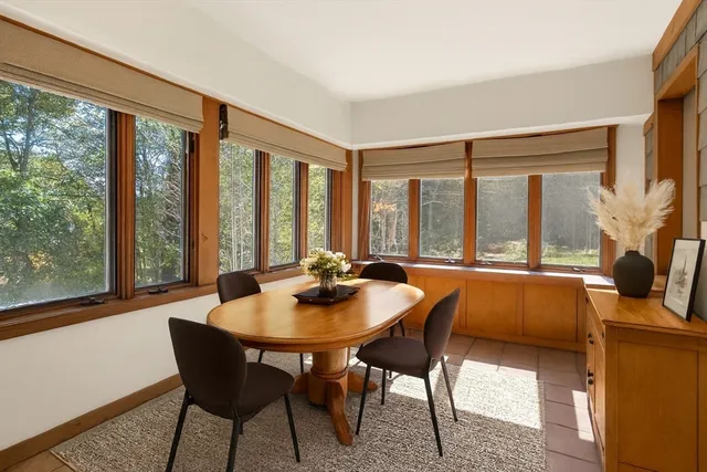 a view of a city with lush green forest