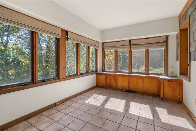 an aerial view of a house with garden space and sitting area
