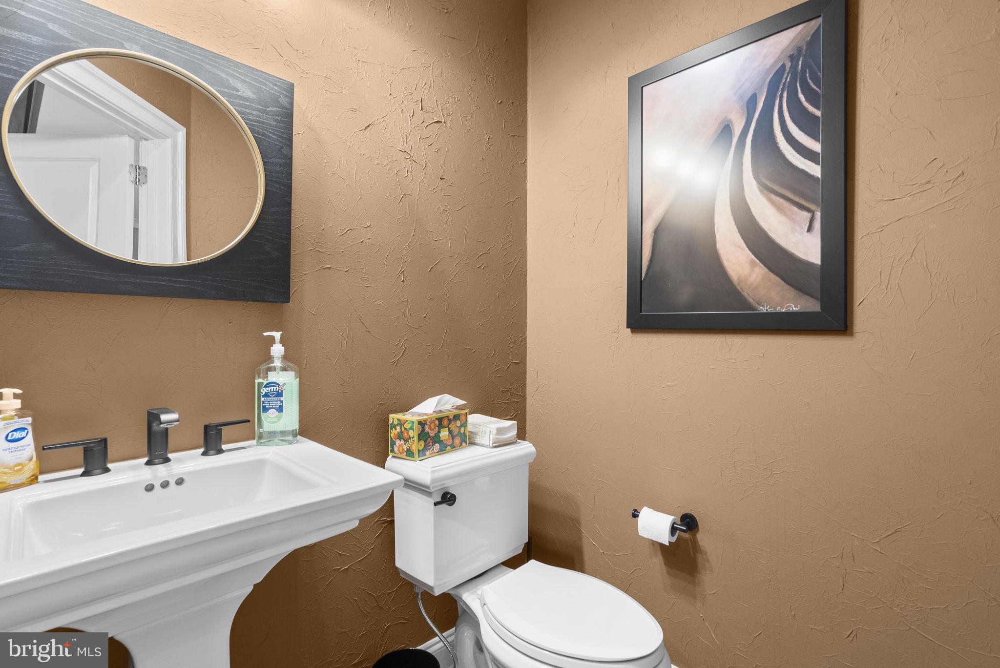 4702 Edgefield Road Bethesda, MD 20814 - Photo 30 of 58 Chic half-bath with modern accents.