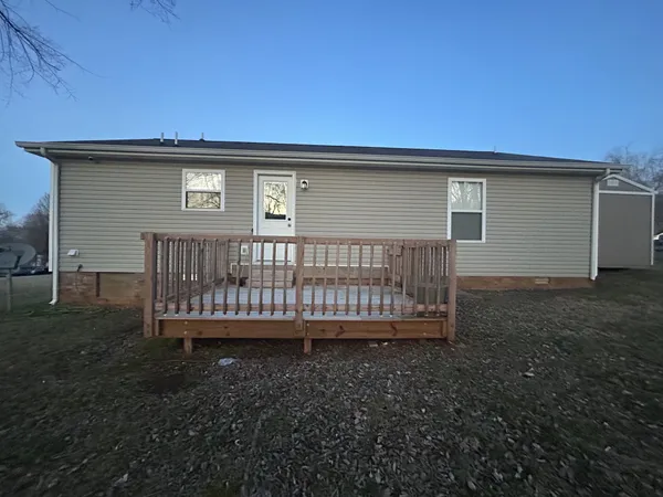 a view of balcony with wooden floor and outdoor seating
