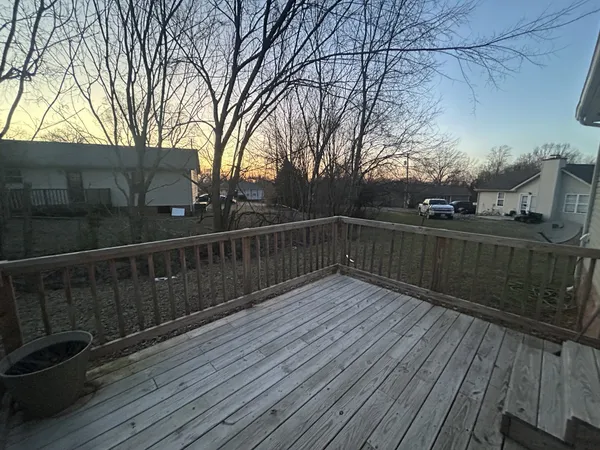 a view of front door and a yard