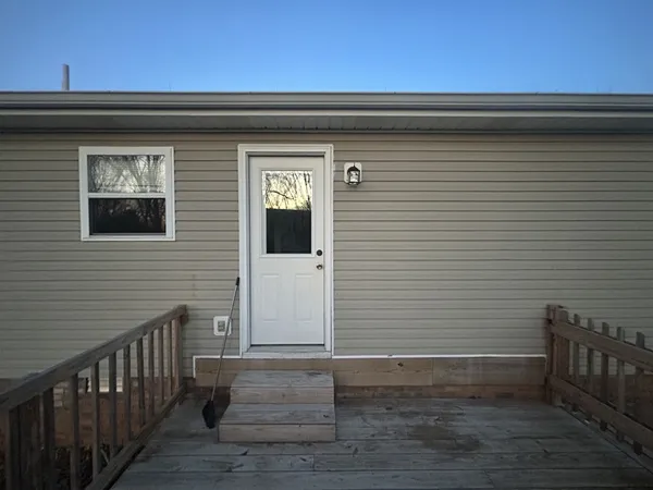 a view of deck with wooden floor and fence