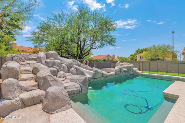 a view of a garden with a large tree