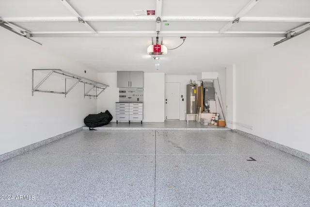 a view of a livingroom with a ceiling fan and entryway