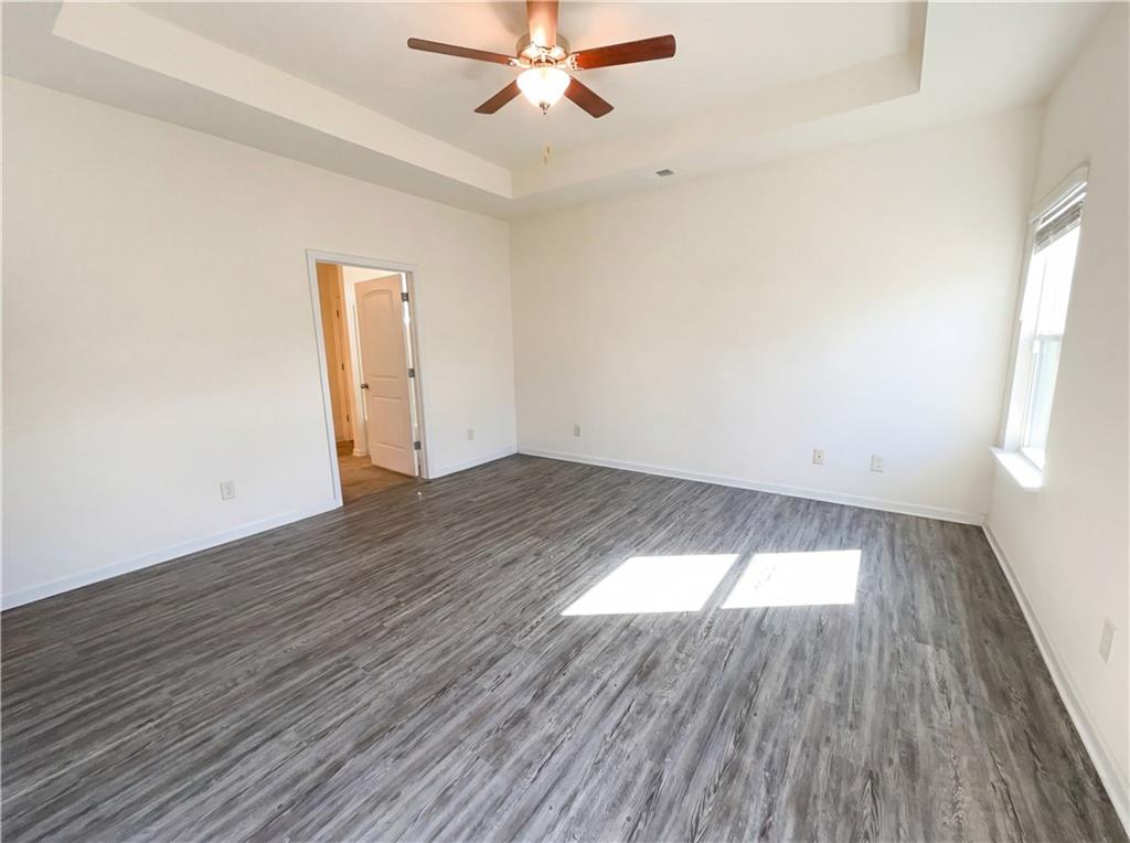 2682 North Broad Street Extension Northeast Rome, GA 30161 - Photo 12 of 23 wooden floor in an empty room with a window