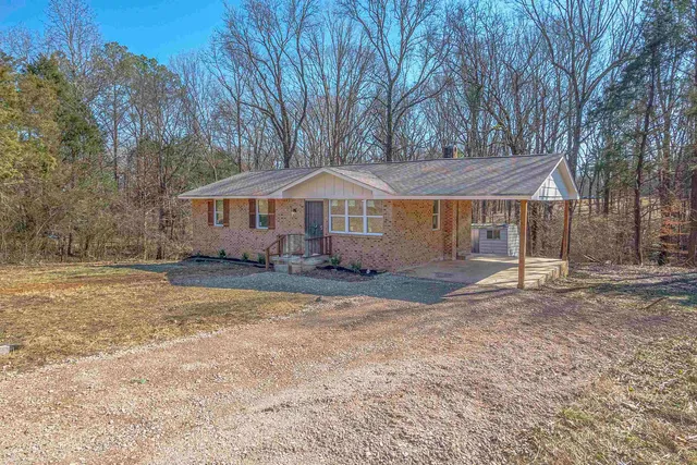 a house with trees in the background