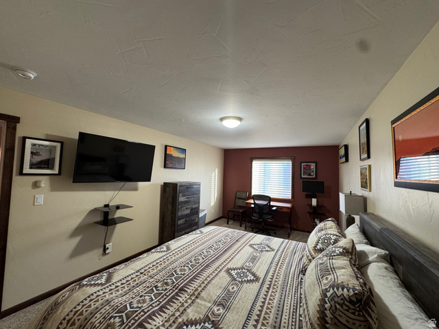 3439 Westwater Road Moab, UT 84532 - Photo 46 of 64 Carpeted bedroom featuring baseboards