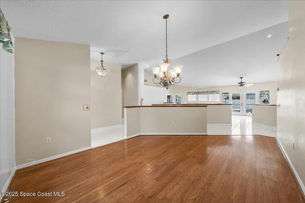 a kitchen with stainless steel appliances granite countertop a sink refrigerator and cabinets