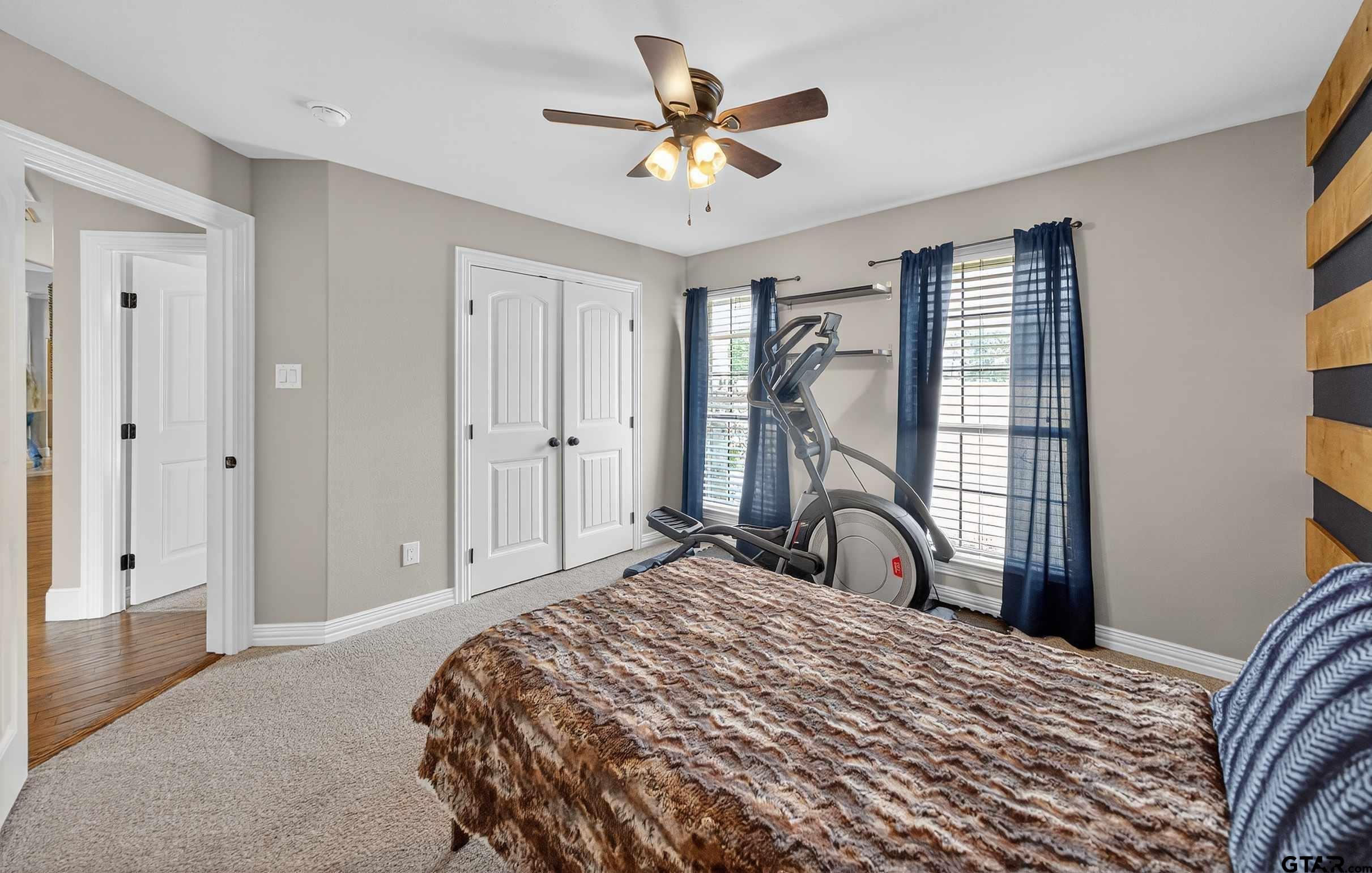 2621 Anderson County Road Palestine, TX 75803 - Photo 23 of 46 a bedroom with a bed dresser and a window