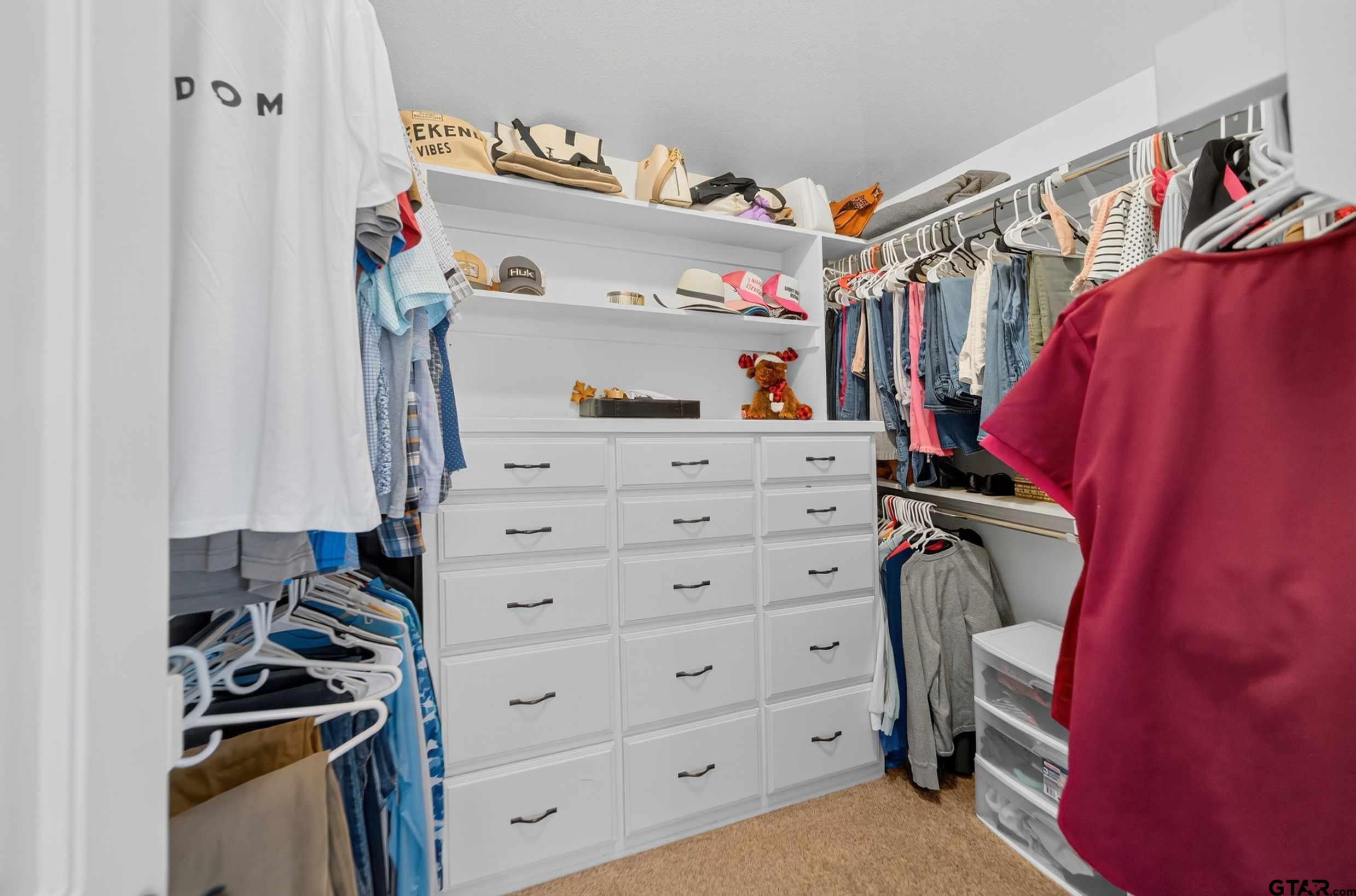 2621 Anderson County Road Palestine, TX 75803 - Photo 35 of 46 a view of walk in closet with clothes and shoes