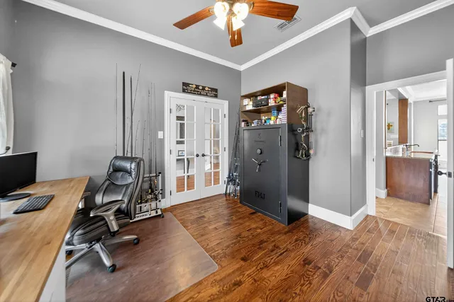a view of a workspace with wooden floor and bathroom
