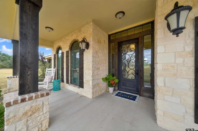 a front view of a house with outdoor seating