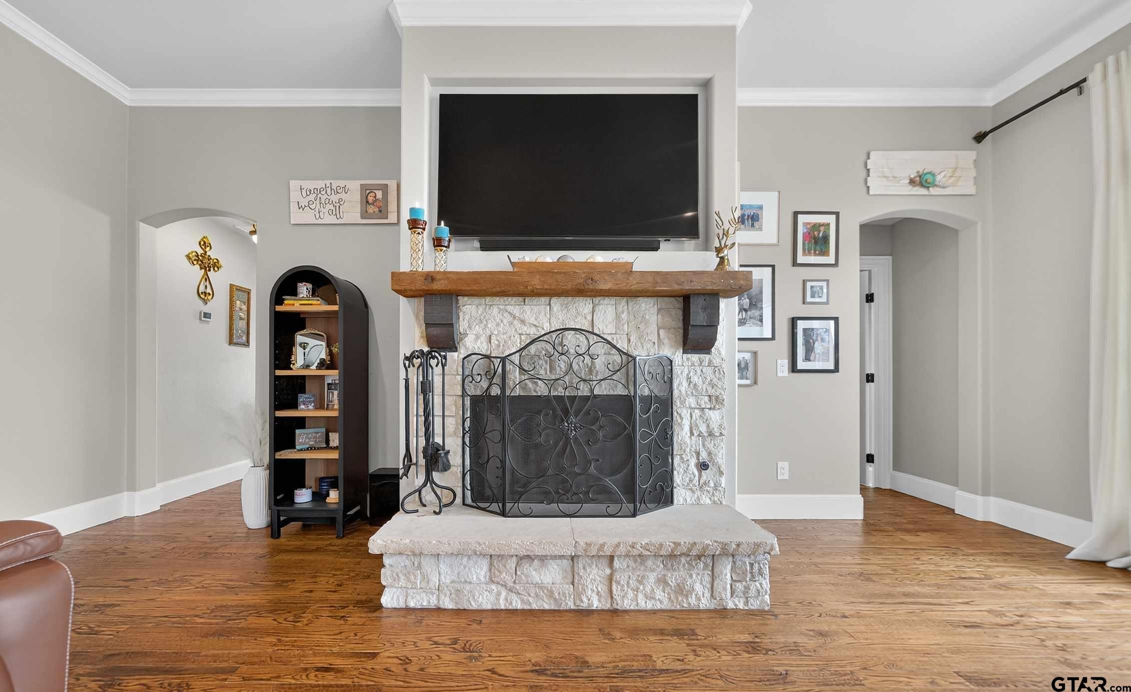 2621 Anderson County Road Palestine, TX 75803 - Photo 8 of 46 a living room with fireplace furniture and a flat screen tv