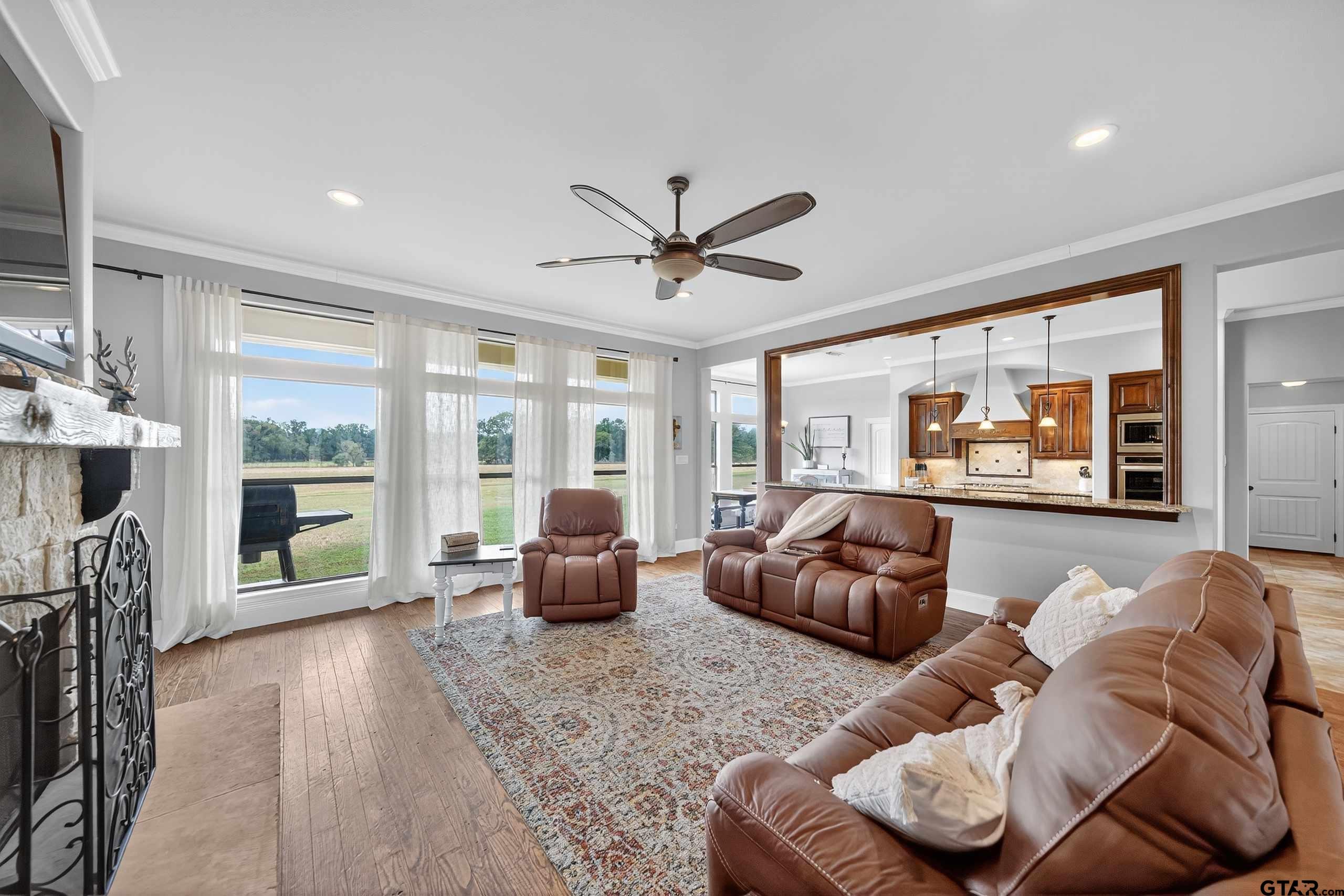 2621 Anderson County Road Palestine, TX 75803 - Photo 10 of 46 a living room with furniture and large windows