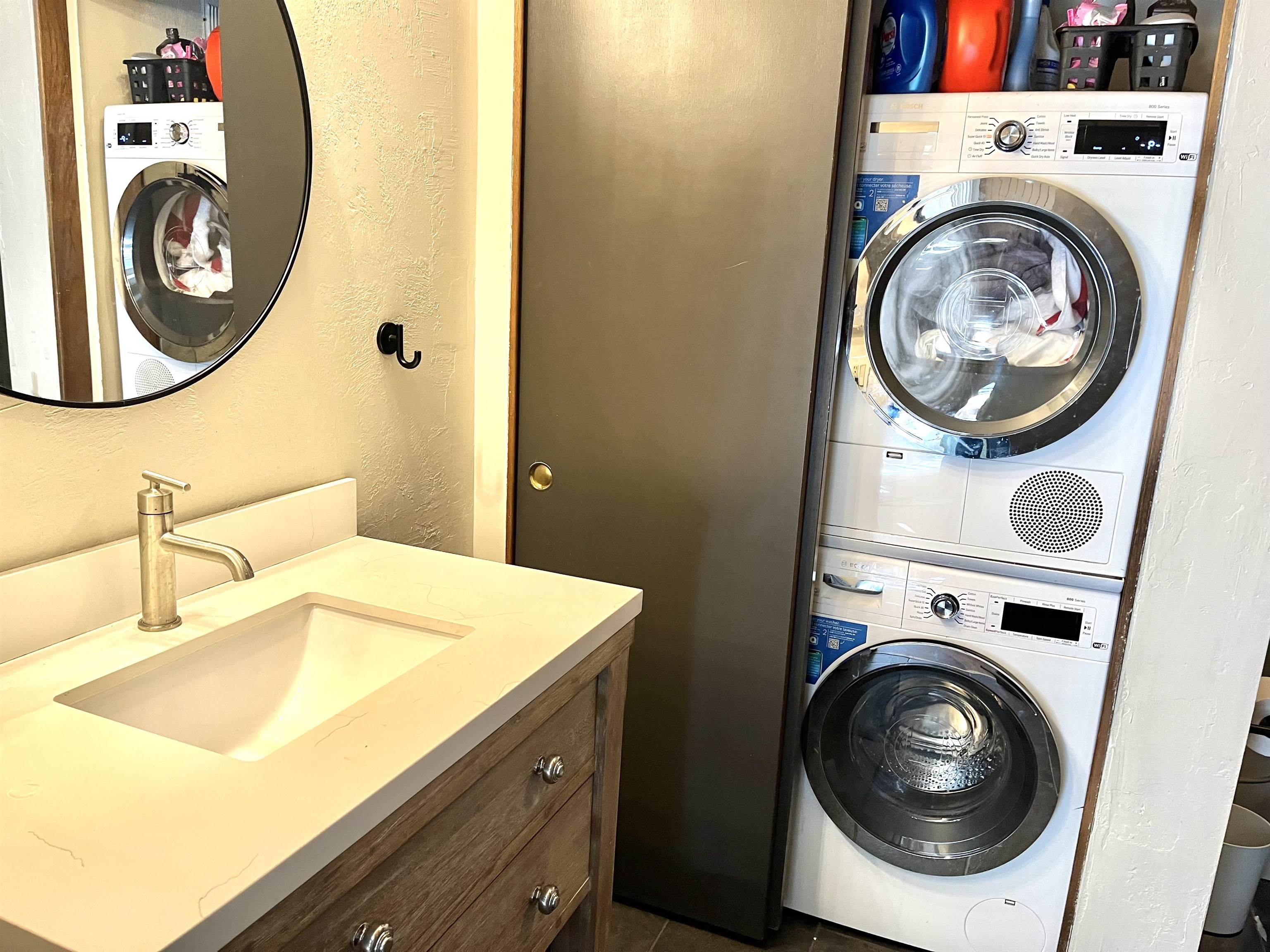 286 Old Mammoth Road, Unit 7 Mammoth Lakes, CA 93546 - Photo 14 of 32 Laundry room featuring a textured wall and stacked washer and clothes dryer