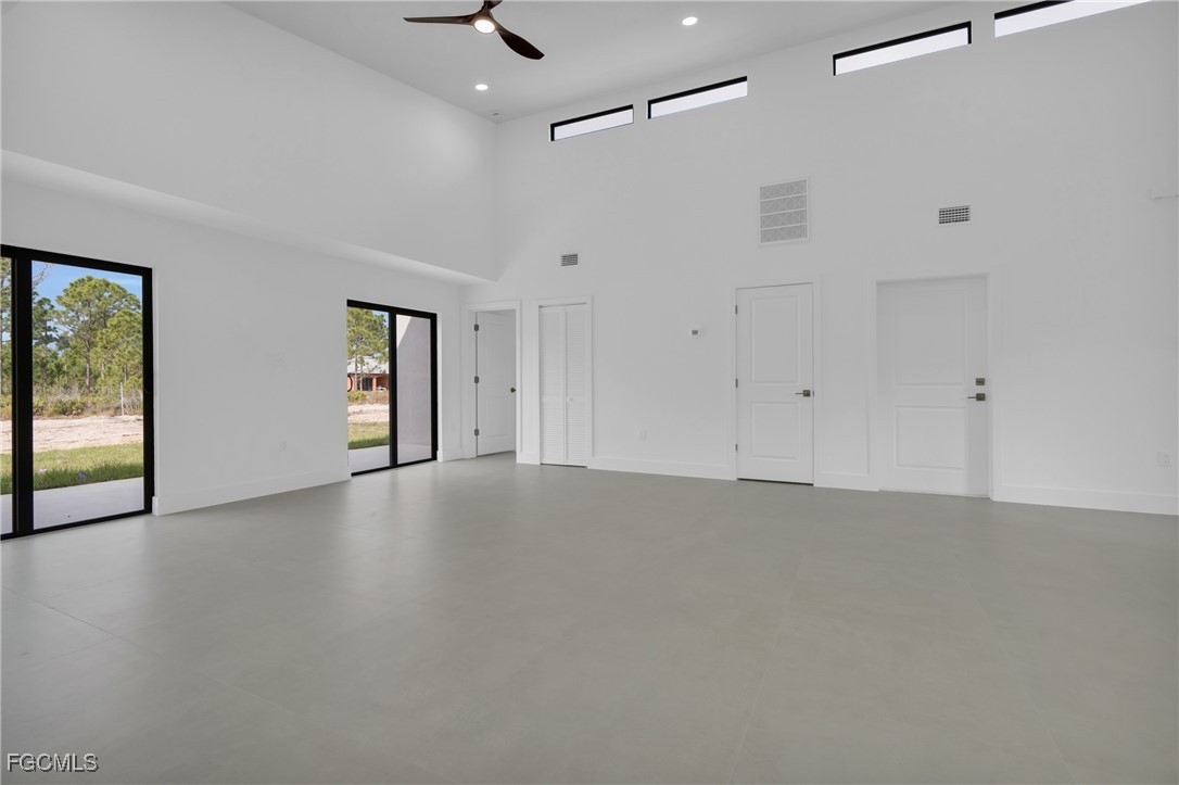 1011 State Avenue Lehigh Acres, FL 33972 - Photo 17 of 34 an empty room with windows and closet