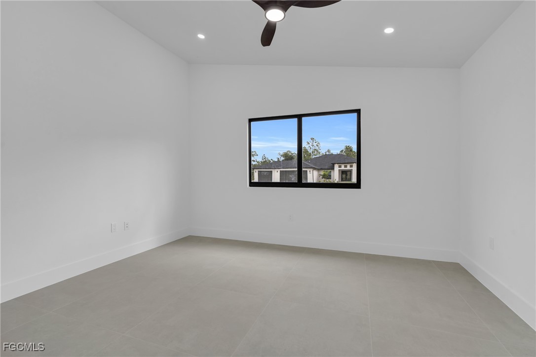 1011 State Avenue Lehigh Acres, FL 33972 - Photo 26 of 34 an empty room with a window