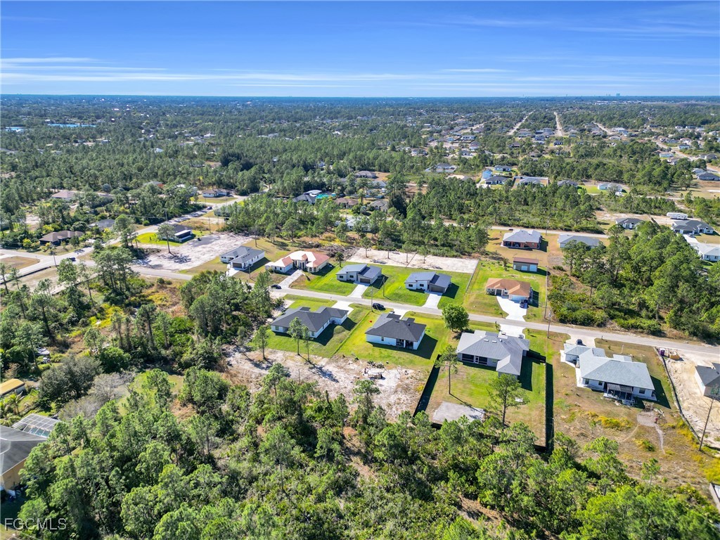 1011 State Avenue Lehigh Acres, FL 33972 - Photo 32 of 34 an aerial view of multiple house with yard