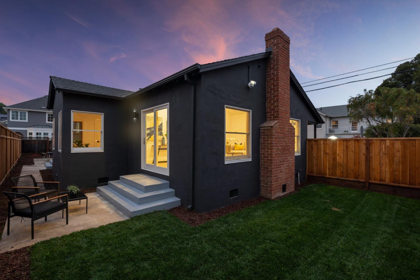 201 Channing Road Burlingame, CA 94010 - Photo 2 of 52 a backyard of a house with table and chairs