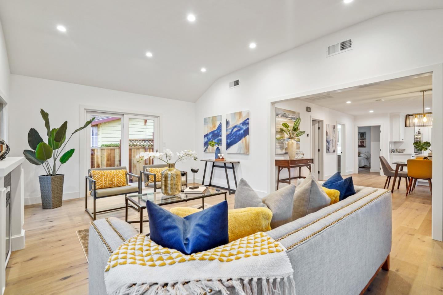 201 Channing Road Burlingame, CA 94010 - Photo 11 of 52 a living room with furniture kitchen view and a wooden floor