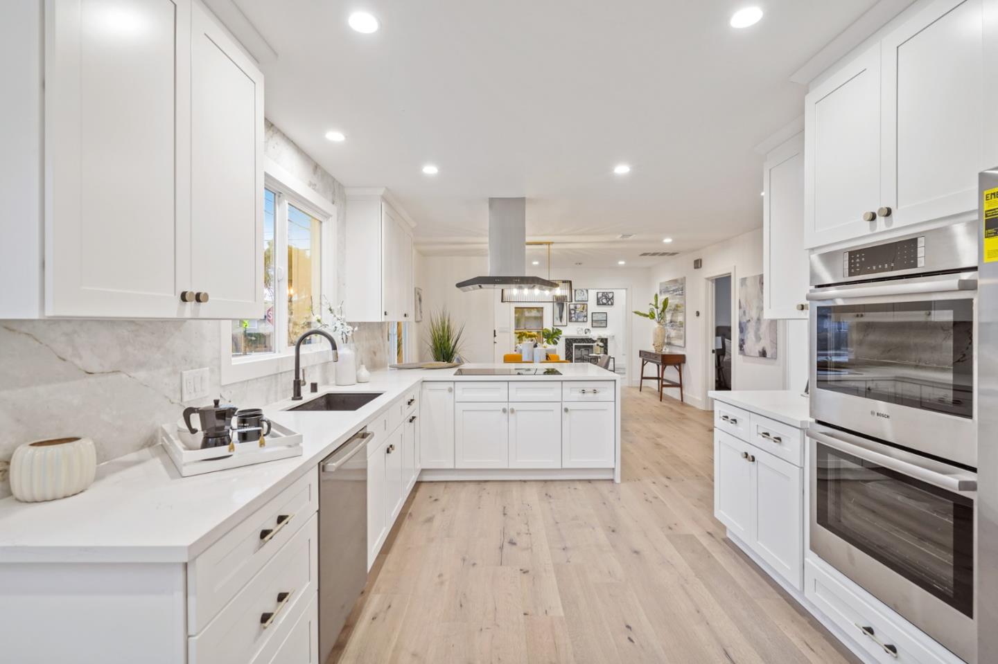 201 Channing Road Burlingame, CA 94010 - Photo 19 of 52 a kitchen with white cabinets appliances and sink