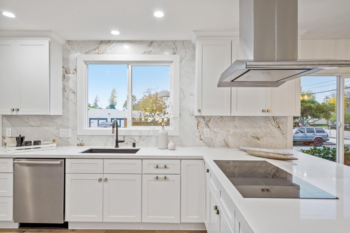 201 Channing Road Burlingame, CA 94010 - Photo 21 of 52 a kitchen with a sink cabinets and window