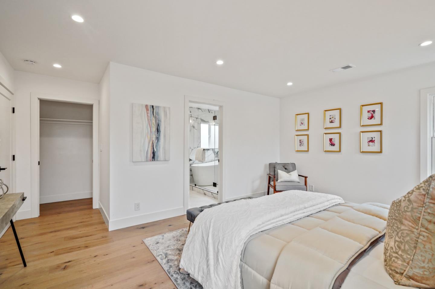 201 Channing Road Burlingame, CA 94010 - Photo 23 of 52 a bedroom with a large bed and a chandelier