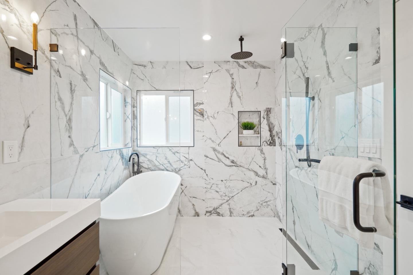 201 Channing Road Burlingame, CA 94010 - Photo 29 of 52 a bathroom with a granite countertop sink a toilet and shower