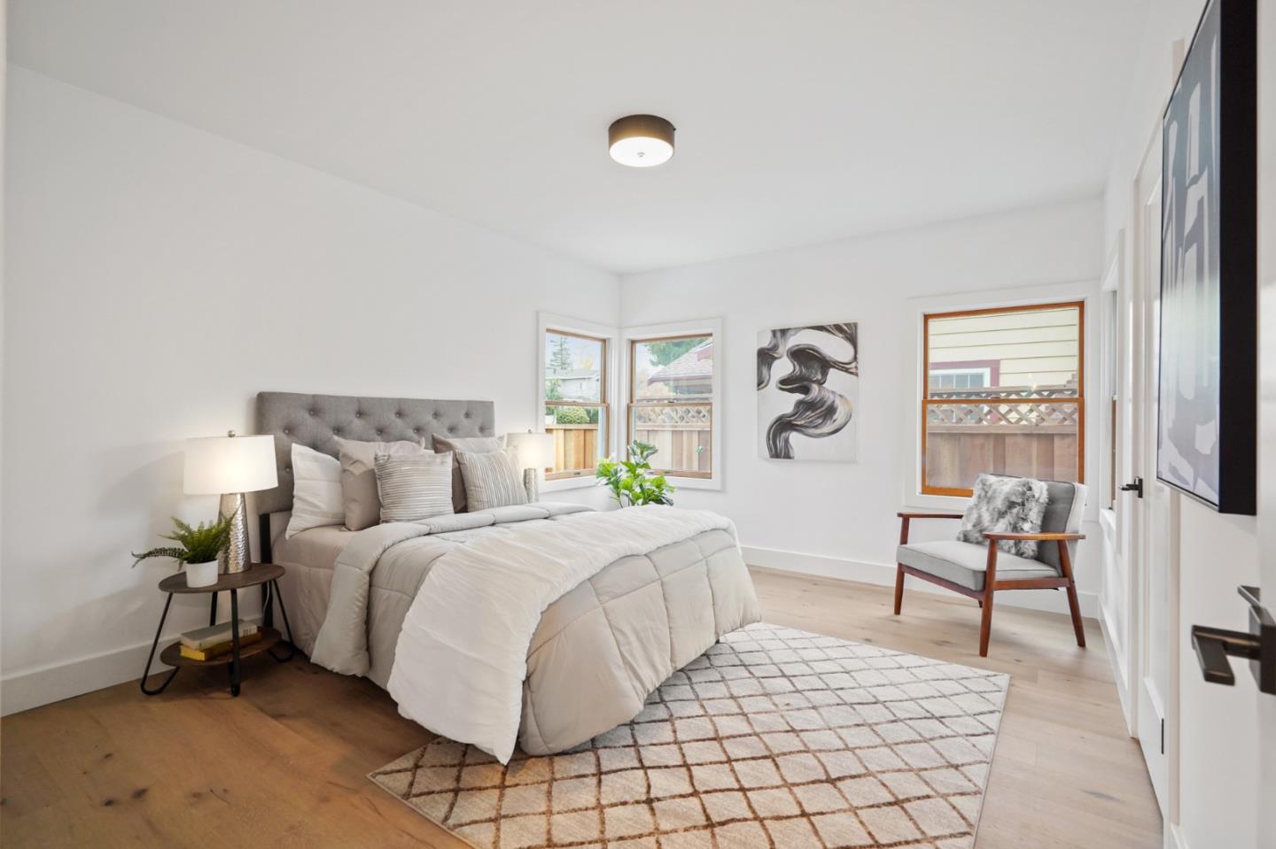 201 Channing Road Burlingame, CA 94010 - Photo 40 of 52 a bedroom with a bed and a flat tv screen on the dresser