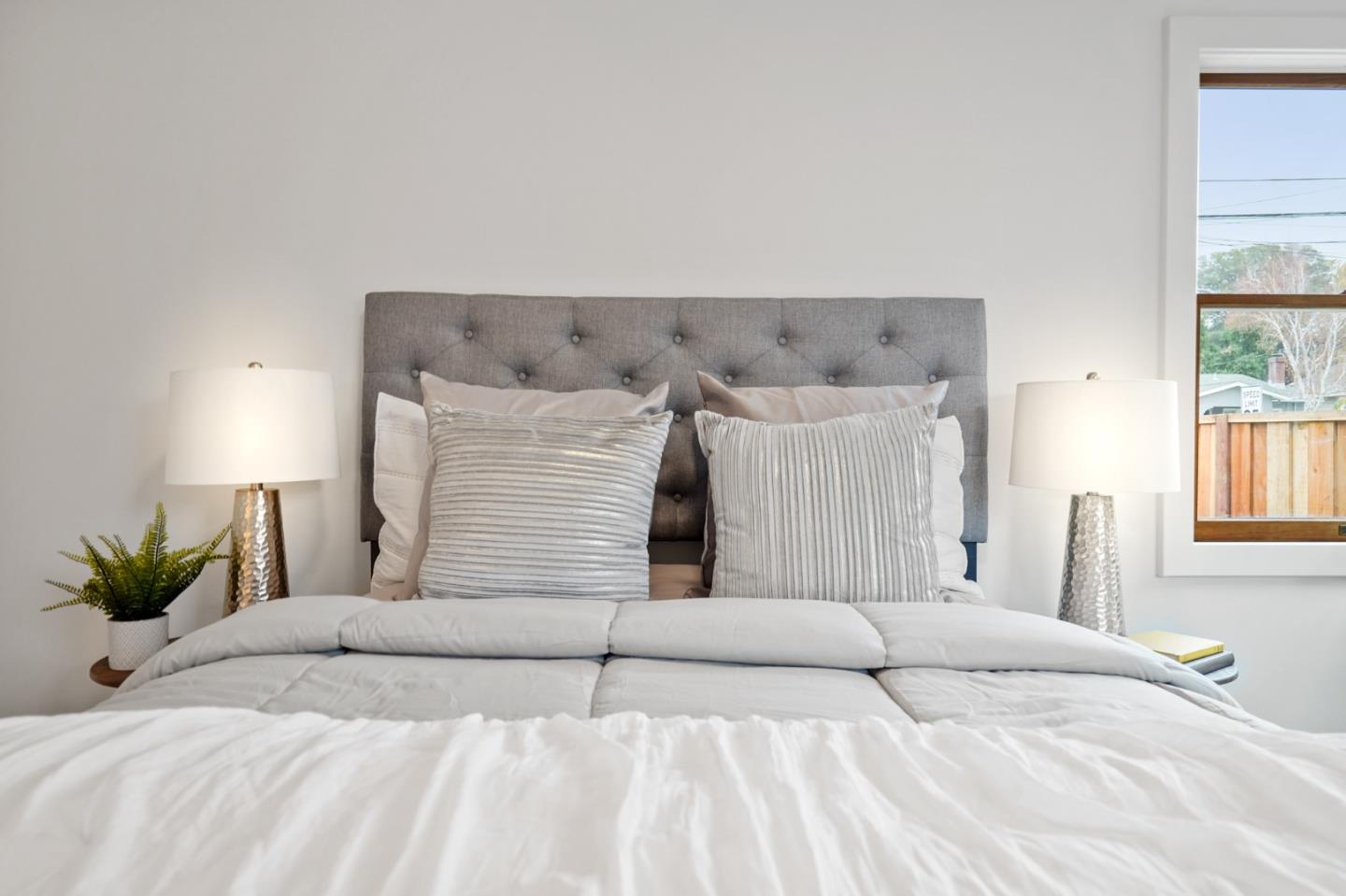 201 Channing Road Burlingame, CA 94010 - Photo 42 of 52 a bedroom with a bed and window