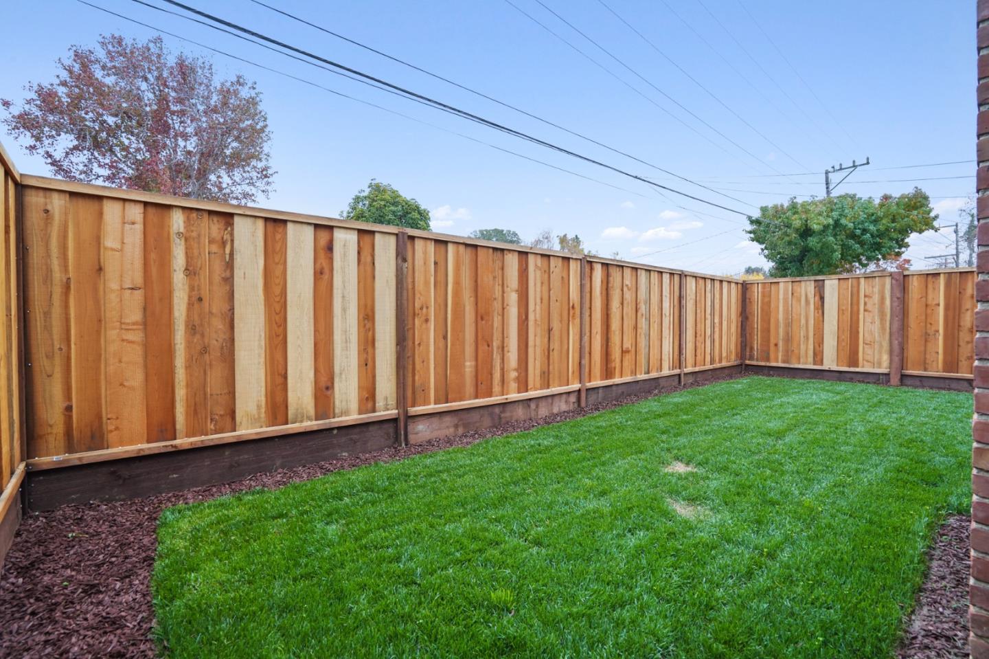 201 Channing Road Burlingame, CA 94010 - Photo 43 of 52 a view of a backyard with wooden fence