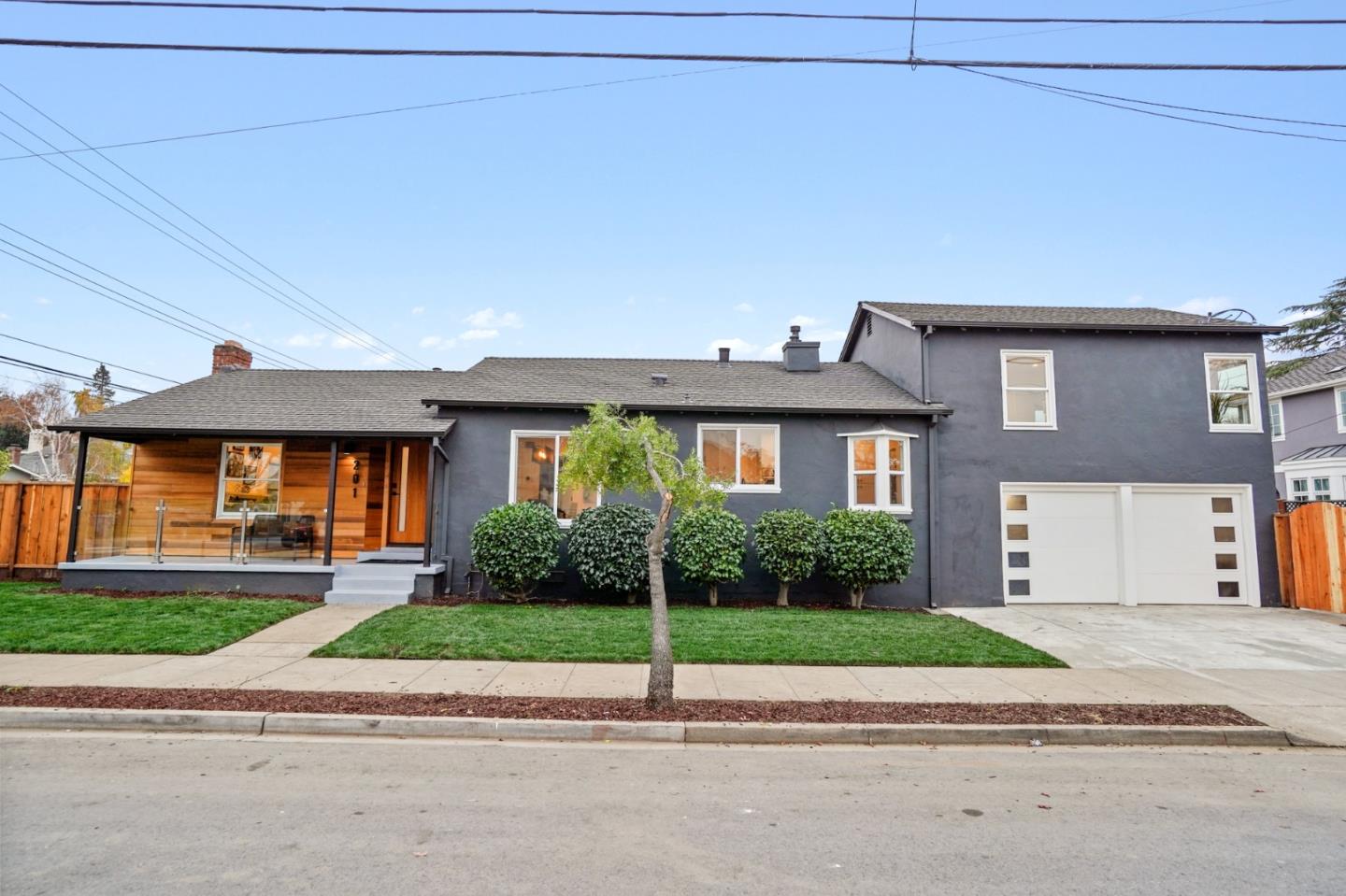 201 Channing Road Burlingame, CA 94010 - Photo 47 of 52 a front view of a house with a yard and garage