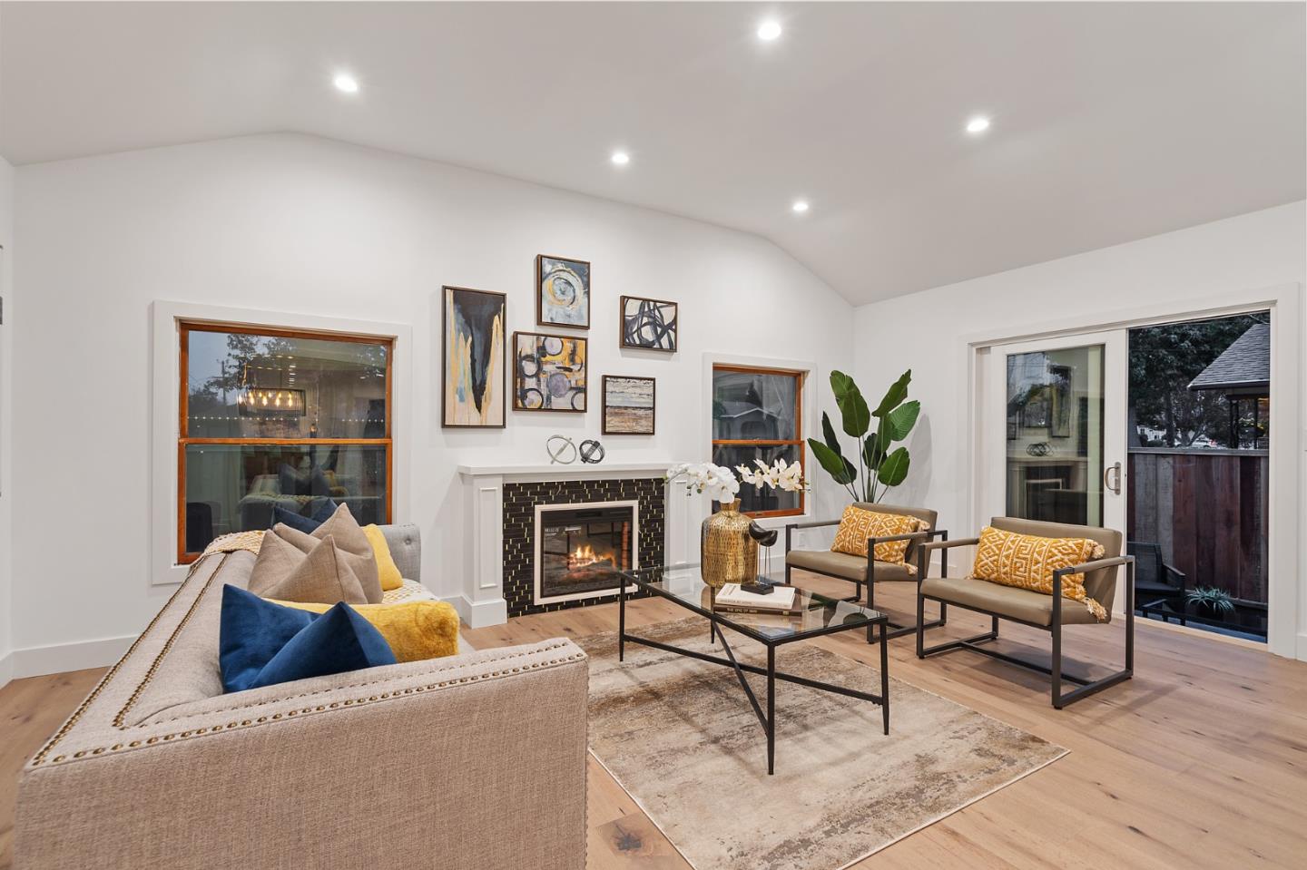 201 Channing Road Burlingame, CA 94010 - Photo 7 of 52 a living room with furniture and a fireplace