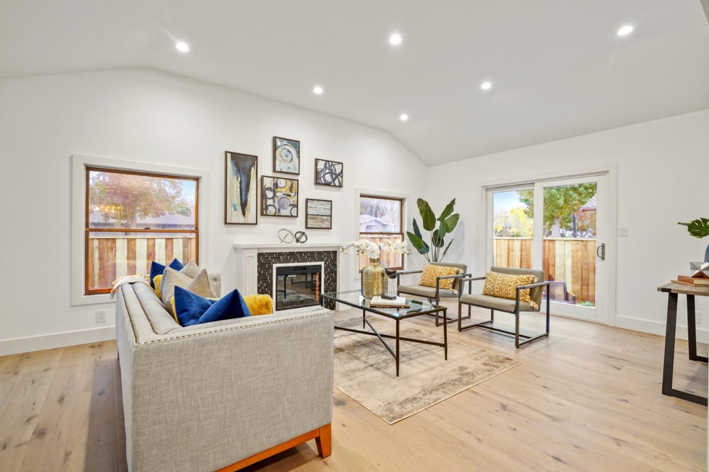 201 Channing Road Burlingame, CA 94010 - Photo 8 of 52 a living room with furniture fireplace and window
