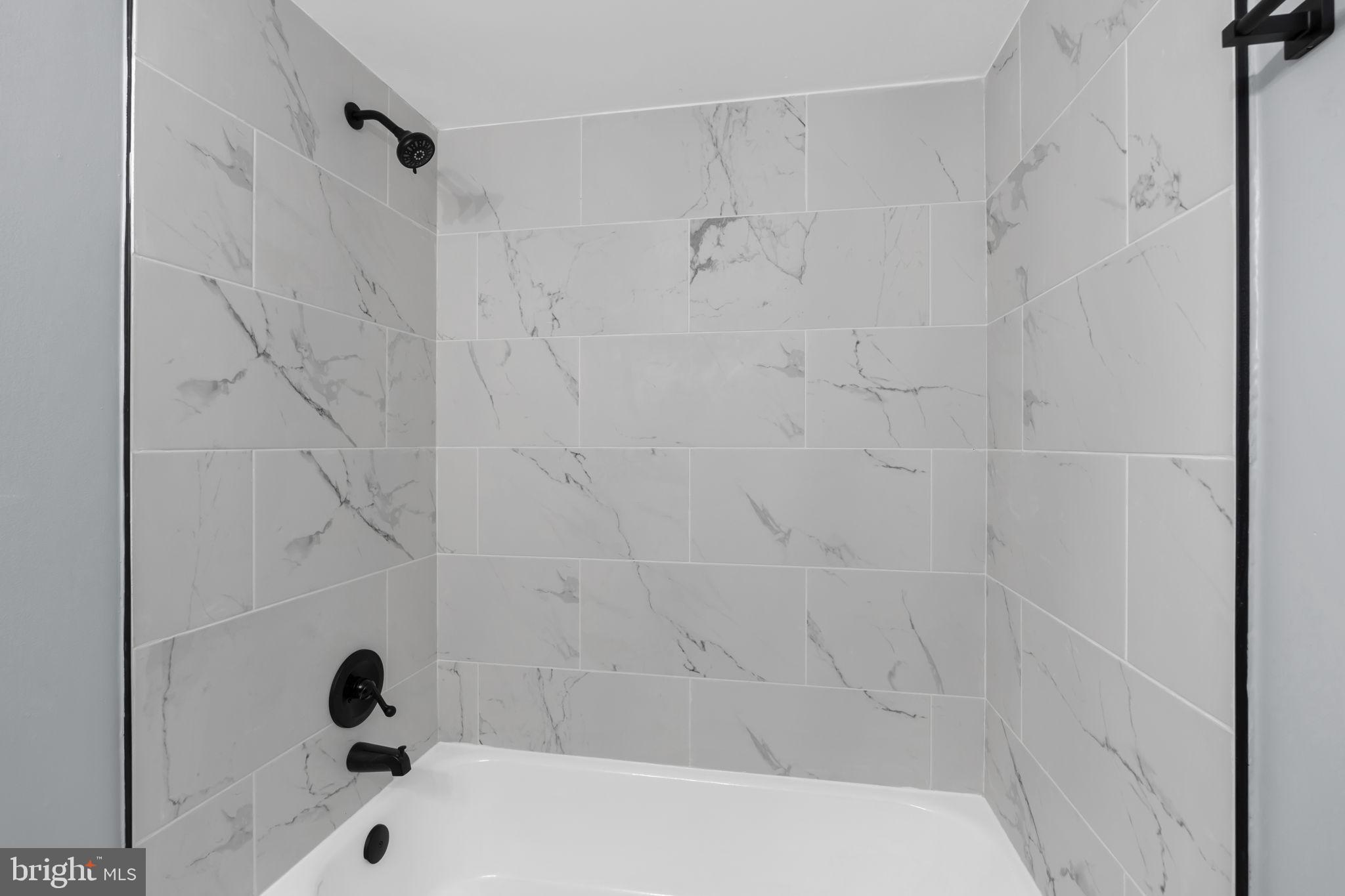 1245 4th Street Southwest, Unit E210 Washington, DC 20024 - Photo 16 of 28 a bathroom with a bathtub