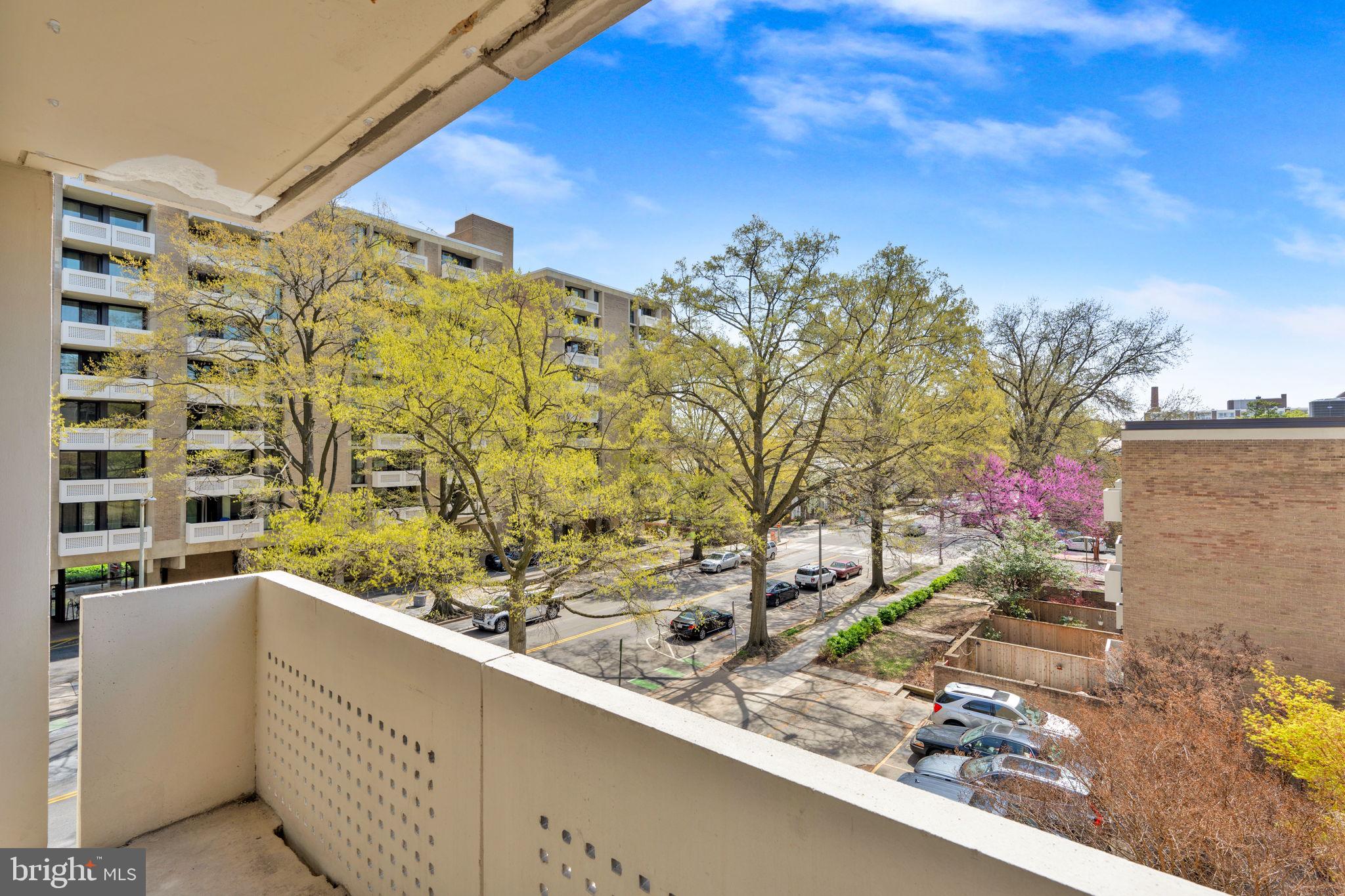 1245 4th Street Southwest, Unit E210 Washington, DC 20024 - Photo 17 of 28 a view of a balcony with wooden floor and a outdoor space