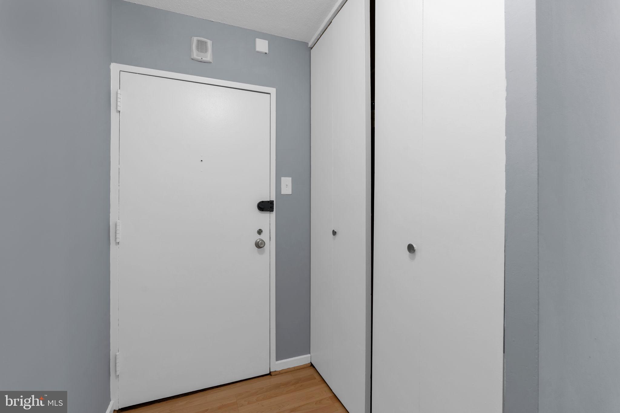 1245 4th Street Southwest, Unit E210 Washington, DC 20024 - Photo 20 of 28 a view of front door with hallway