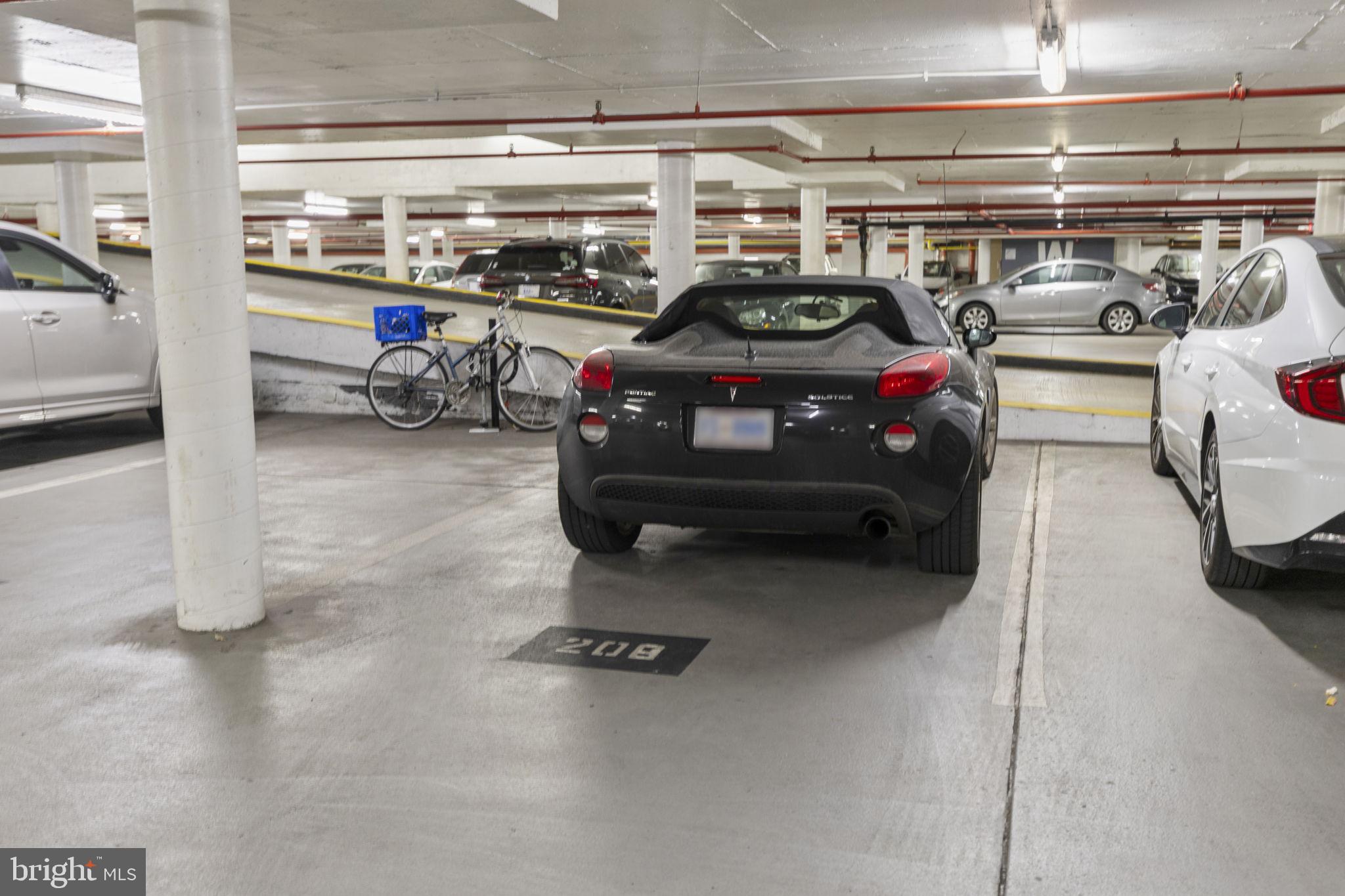 1245 4th Street Southwest, Unit E210 Washington, DC 20024 - Photo 25 of 28 a view of parking garage with cars
