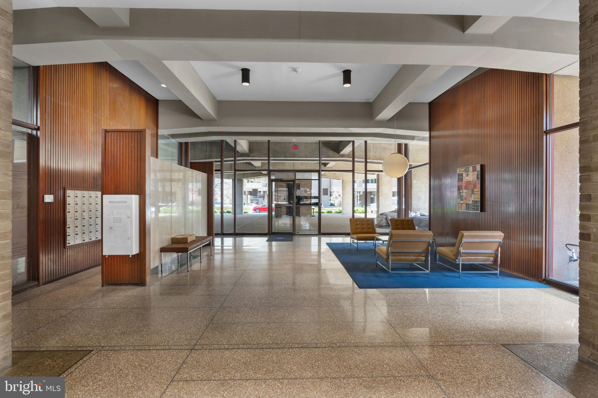 1245 4th Street Southwest, Unit E210 Washington, DC 20024 - Photo 26 of 28 a lobby with furniture and floor to ceiling window