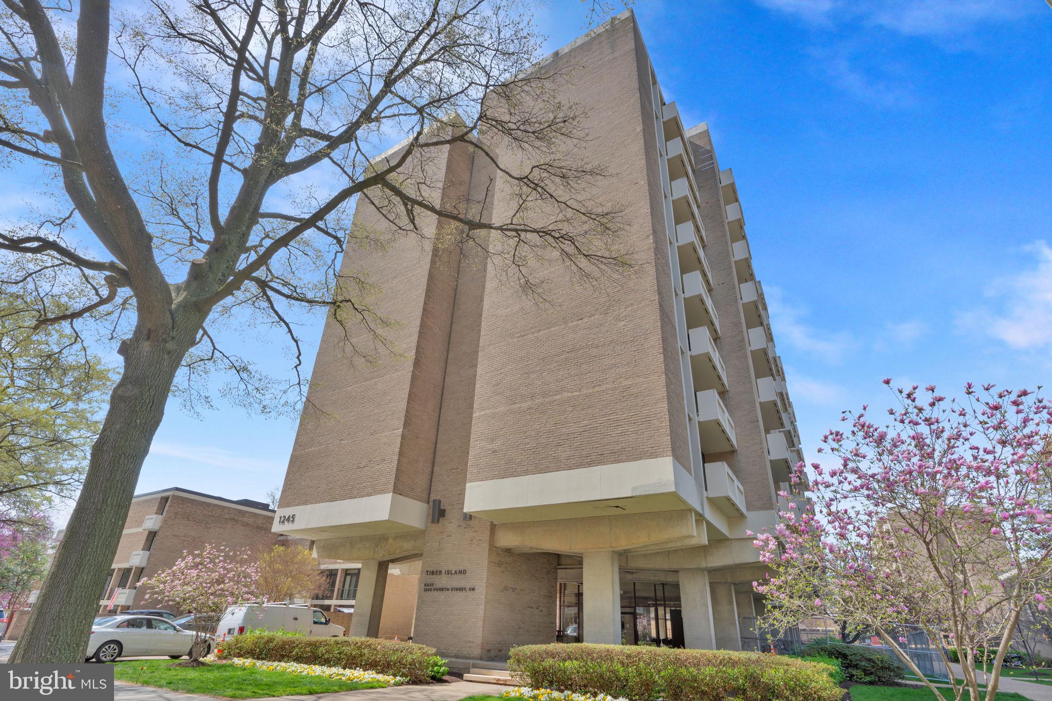 1245 4th Street Southwest, Unit E210 Washington, DC 20024 - Photo 27 of 28 a front view of a multi story residential apartment building